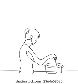 woman stands with a ladle in her hand and stirs the cooking dish in a pan - one line art vector. concept of cooking at home, female chef