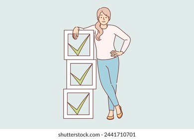 Woman stands near checkboxes with ticks symbolizing task management to increase productivity. Young casual girl uses task management to monitor progress and remind of important goals.