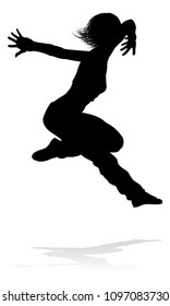 A woman street dance hip hop dancer in silhouette