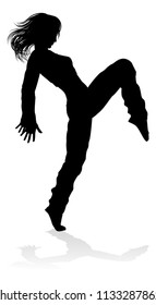 A woman street dance hip hop dancer in silhouette