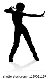 A woman street dance hip hop dancer in silhouette