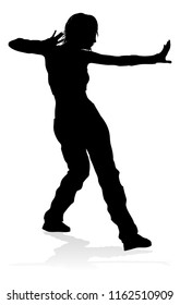 A woman street dance hip hop dancer in silhouette