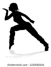 A woman street dance hip hop dancer in silhouette