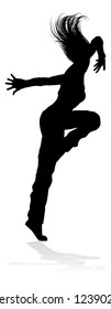 A woman street dance hip hop dancer in silhouette