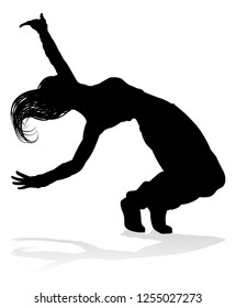 A woman street dance hip hop dancer in silhouette