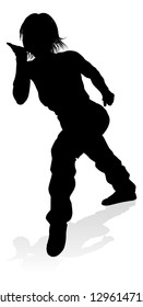 A woman street dance hip hop dancer in silhouette