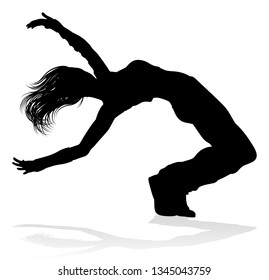 A woman street dance hip hop dancer in silhouette