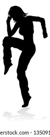 A woman street dance hip hop dancer in silhouette