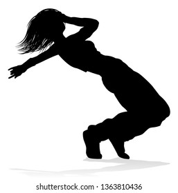 A woman street dance hip hop dancer in silhouette