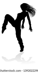 A woman street dance hip hop dancer in silhouette