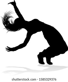 A woman street dance hip hop dancer in silhouette