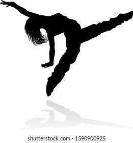 A woman street dance hip hop dancer in silhouette