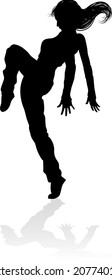 A woman street dance hip hop dancer in silhouette