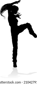 A woman street dance hip hop dancer in silhouette