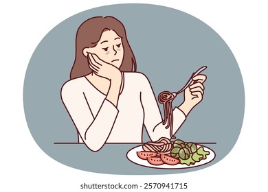 Woman suffering from anorexia is sad due to lack of appetite and sits at table with spaghetti and salad in plate. Skinny girl with sickly appearance suffers from anorexia after wrong diet