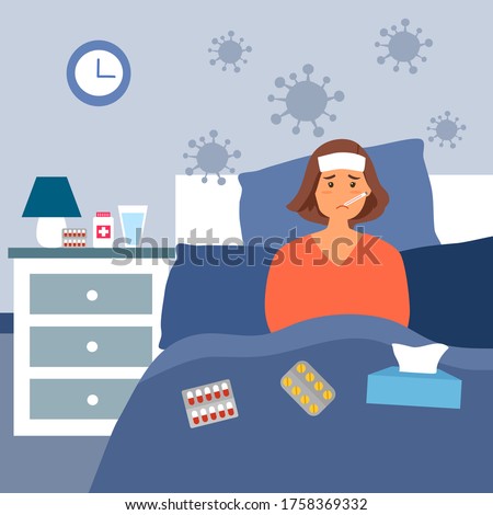 Woman suffering from flu in bed under blanket. She has fever and take thermometer in mouth with tissue paper and medicine on bed.  Flu or cold allergy symptom.  Corona virus influenza infection.