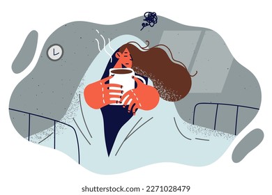 Woman suffering from melancholy sits on bed wrapped in blanket and drinks hot coffee feeling stressed due to loneliness. Girl with psychological problems and melancholy hides under warm blanket 