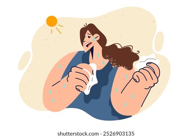 Woman suffers from heat causing exhaustion and sunstroke, breaking out in sweat due to bright sun. Heat and global warming torment young girl who needs house with air conditioning.