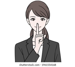 A woman in a suit with her index finger on her mouth 