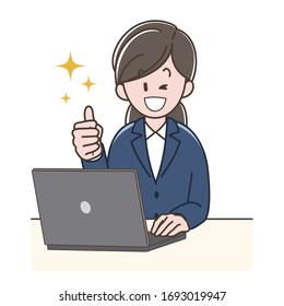 A woman in a suit operating a PC while doing thumbs-up sign