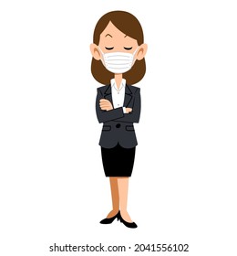 A woman in a suit wearing a mask to think with her arms folded
