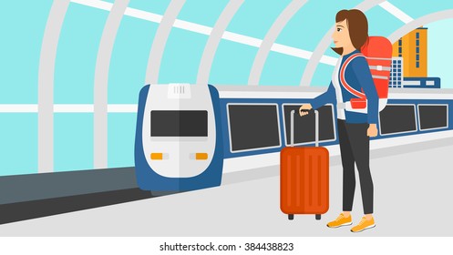 Woman with suitcase on wheels and briefcase.