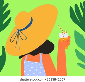Woman in a summer hat with a cocktail