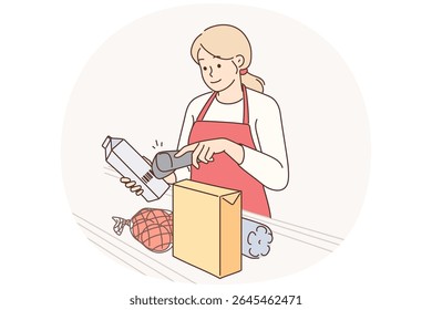 Woman supermarket cashier uses scanner to read barcodes on products of selected shop customers. Girl cashier stands near conveyor belt helping sellers to serve customers of grocery store