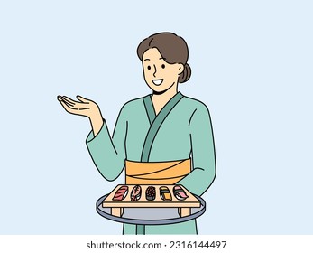 Woman sushi master with maki appetizer on wooden tray dressed in traditional asian kimono. Girl works in japanese food restaurant serving sushi from rice and fresh seafood to visitors.