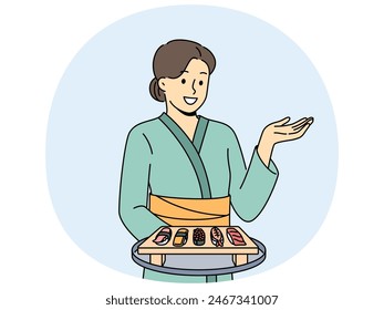 Woman sushi master with maki appetizer on wooden tray dressed in traditional asian kimono. Girl works in japanese food restaurant serving sushi from rice and fresh seafood to visitors.