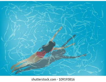 woman is swimming under clear blue water