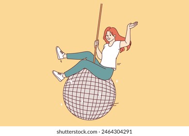 Woman swings on large disco ball and waves hand welcomingly, inviting guests to student party with fiery dancing. Disco ball for dance floor symbolizes great festive rave in nightclub