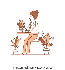woman in the table drinking coffee with house plants