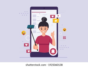 Woman takes a selfie. Female blogger, online blogging