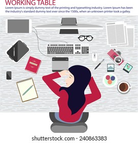 A woman taking a nap on working table.