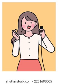 A woman taking a selfie with a camera switch in her hand. finger heart.