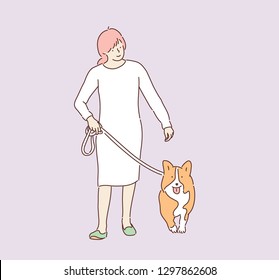 A woman is taking a walk with a dog. hand drawn style vector design illustrations. 