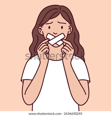 Woman tapes her own mouth closed, expressing emotional repression, fear of speaking up, and inner trauma. Symbol of mental health issues and societal pressure