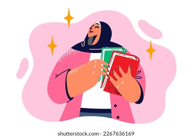 Woman teacher in arabic headdress holding two books for teaching university or college students. Beautiful girl student in Muslim headscarf with textbooks for education and knowledge 