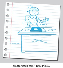 Woman teacher sitting at the desk in the classroom