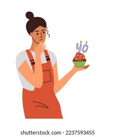 The woman thought about her age, 40 years. Midlife crisis. Cupcake with festive candles.