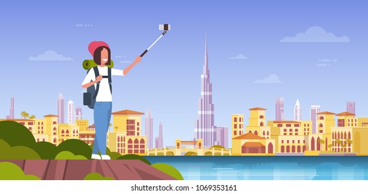 Woman Tourist With Backpack Taking Selfie Photo Over Beautiful Dubai City Background