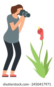 woman tourist taking pictures of flower