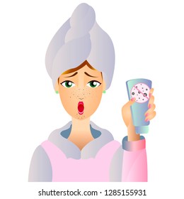 
A woman with a towel on her head and face cream that fights clogged pores. Cream against black dots. Cosmetic procedure. Cosmetology. Facial skin care.