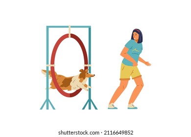 Woman training her sheltie dog on agility field. Dog jumping trough agility ring owner running alongside. Isolated.