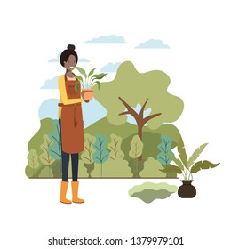 woman with tree to plant in landscape