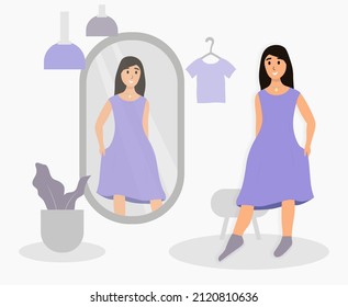 A woman tries on a dress in front of a mirror. The concept of trying on clothes. Fashion clothes. Score