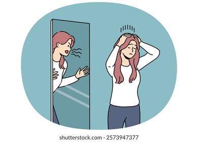 Woman is trying to restrain aggression, standing near mirror with angry reflection, for concept of mental disorder. Girl with mental problems or split personality needs help of psychotherapist