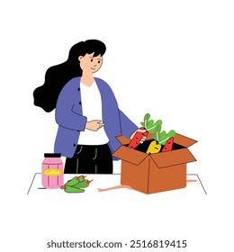 A woman unboxes groceries after shopping or delivery