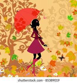 woman under an umbrella in the autumn